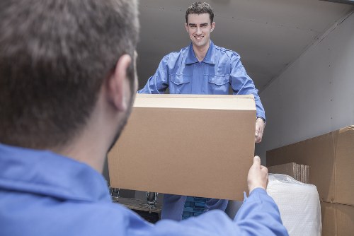Removal team planning a home move in Kennington street setting