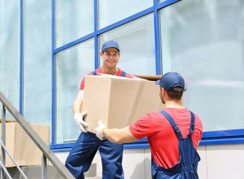 Man and van loading furniture for a move in Kennington