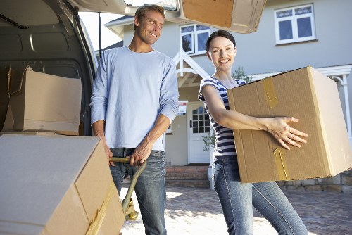 Loading furniture into a moving truck near Kennington flats